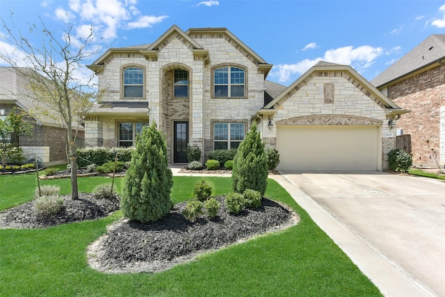 19115 Blooms Rise Dr, Tomball, TX 77377 - french country style house featuring an attached garage, stone siding, driveway, and a front lawn