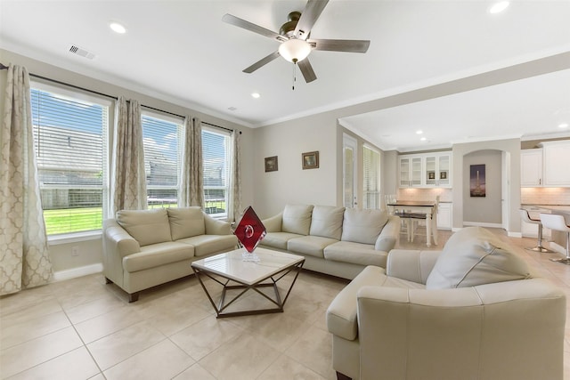 19115 Blooms Rise Dr, Tomball, TX 77377 - living room featuring healthy amount of natural light, a ceiling fan, light tile patterned flooring, crown molding, and recessed lighting