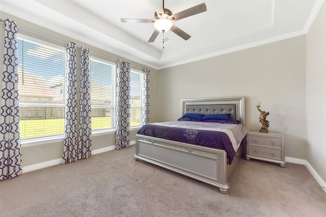 19115 Blooms Rise Dr, Tomball, TX 77377 - carpeted bedroom featuring baseboards, crown molding, ceiling fan, and a raised ceiling