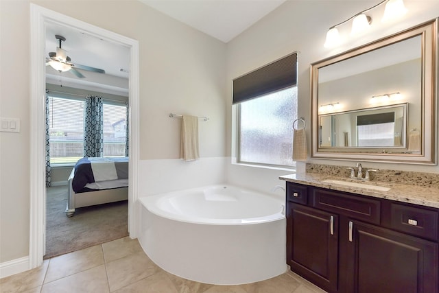 19115 Blooms Rise Dr, Tomball, TX 77377 - ensuite bathroom featuring a bath, vanity, tile patterned floors, and a ceiling fan