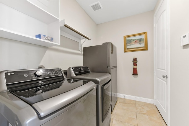 19115 Blooms Rise Dr, Tomball, TX 77377 - laundry area with separate washer and dryer and baseboards