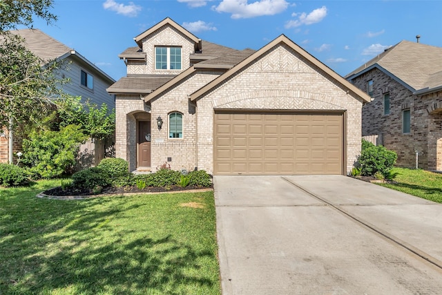12311 Summerbrook Dr, Houston, TX 77066 - french country home featuring brick siding, a front yard, a garage, driveway, and roof with shingles