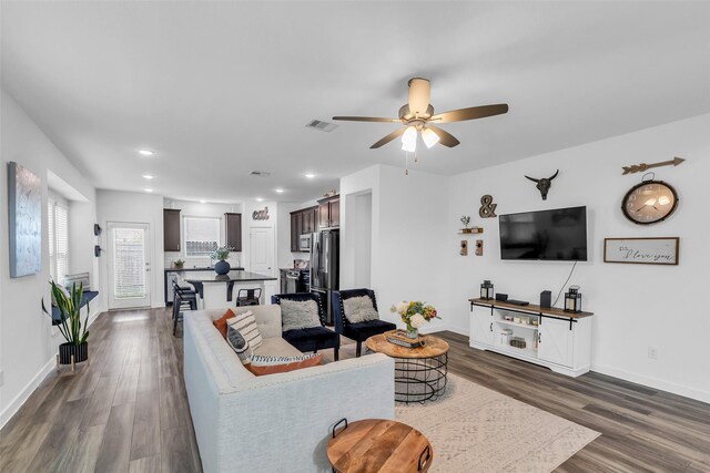 12311 Summerbrook Dr, Houston, TX 77066 - living area with dark wood finished floors, baseboards, ceiling fan, and recessed lighting