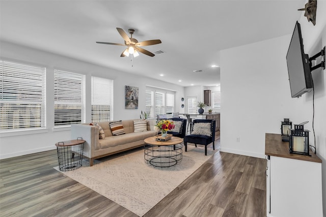 12311 Summerbrook Dr, Houston, TX 77066 - living room with dark wood finished floors, ceiling fan, recessed lighting, and baseboards