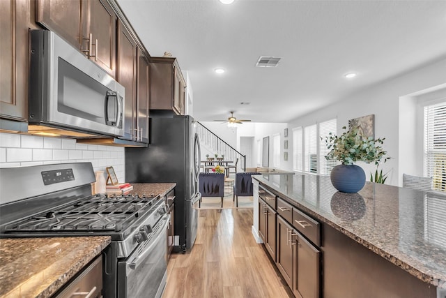 12311 Summerbrook Dr, Houston, TX 77066 - kitchen with stainless steel appliances, light wood-style floors, plenty of natural light, ceiling fan, and recessed lighting