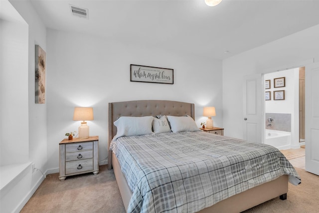 12311 Summerbrook Dr, Houston, TX 77066 - carpeted bedroom featuring ensuite bath and baseboards