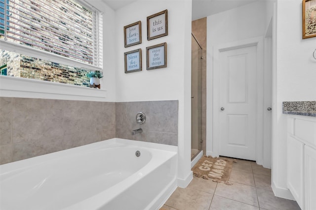12311 Summerbrook Dr, Houston, TX 77066 - bathroom with a bath, a stall shower, vanity, and tile patterned floors