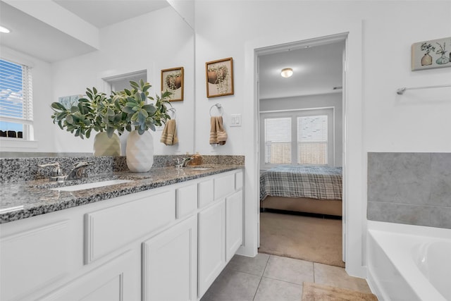 12311 Summerbrook Dr, Houston, TX 77066 - full bath featuring tile patterned floors, healthy amount of natural light, a bath, and double vanity