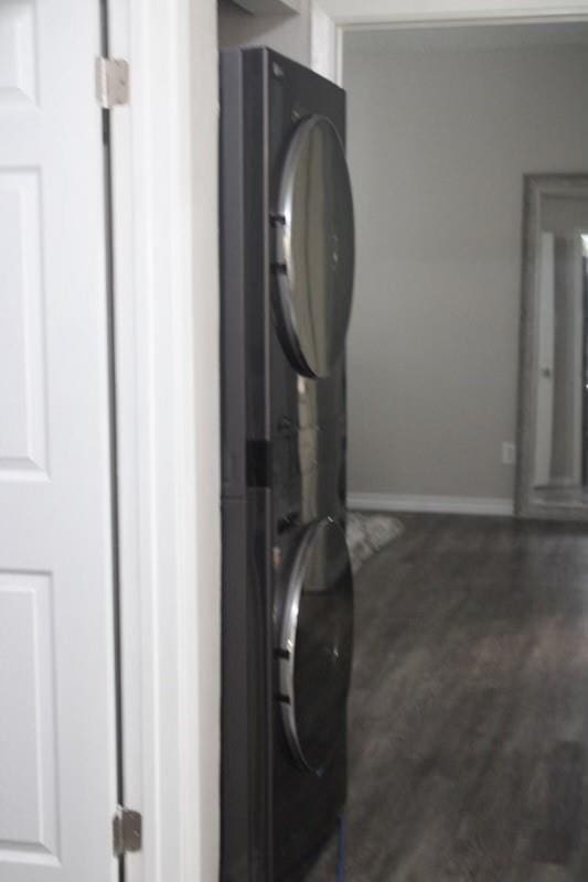 10049 Westpark Dr Unit 113, Houston, TX 77042 - laundry area with stacked washer / drying machine and baseboards