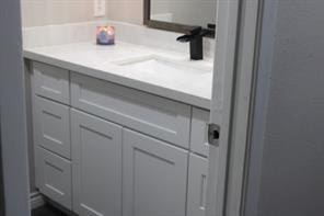10049 Westpark Dr Unit 113, Houston, TX 77042 - bathroom featuring vanity