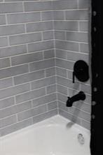 10049 Westpark Dr Unit 113, Houston, TX 77042 - bathroom with shower / tub combination