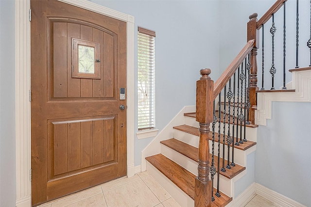 6014 Hamman St, Houston, TX 77007 - foyer with stairway, plenty of natural light, tile patterned flooring, and baseboards