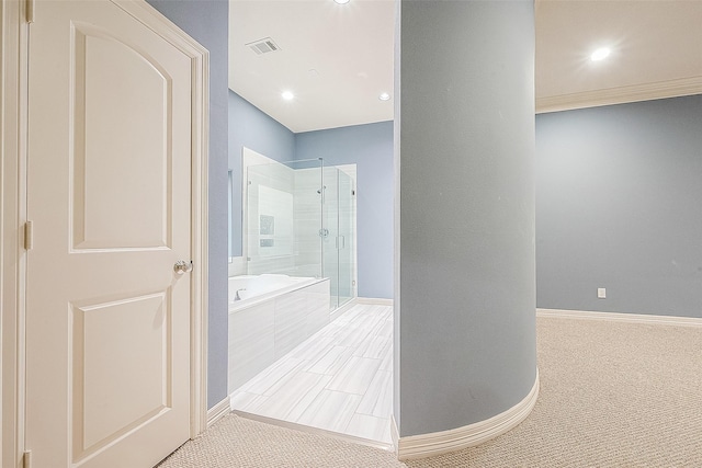 6014 Hamman St, Houston, TX 77007 - bathroom with a shower stall, a bath, baseboards, and recessed lighting
