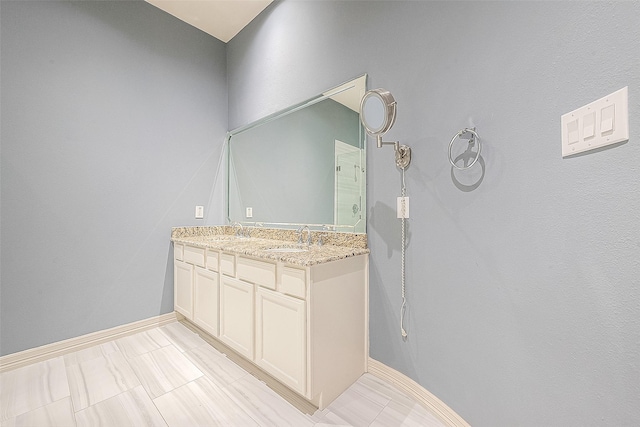 6014 Hamman St, Houston, TX 77007 - full bath featuring baseboards, double vanity, and a shower