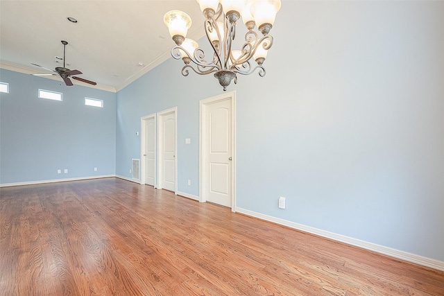 6014 Hamman St, Houston, TX 77007 - empty room with ornamental molding, a ceiling fan, light wood-style flooring, baseboards, and a chandelier