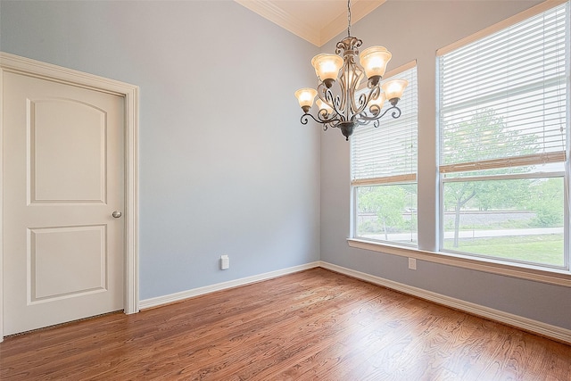 6014 Hamman St, Houston, TX 77007 - empty room with a chandelier, ornamental molding, light wood-style floors, and baseboards