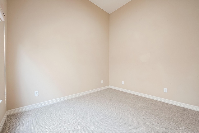 6014 Hamman St, Houston, TX 77007 - carpeted empty room featuring vaulted ceiling and baseboards