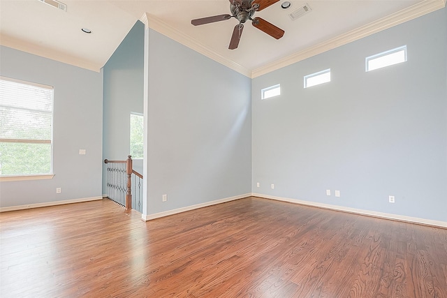 6014 Hamman St, Houston, TX 77007 - empty room featuring crown molding, plenty of natural light, wood finished floors, a ceiling fan, and baseboards