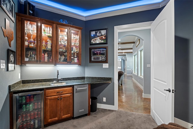 11410 Sunset Ave, Magnolia, TX 77354 - indoor wet bar featuring beverage cooler, arched walkways, baseboards, and ornamental molding