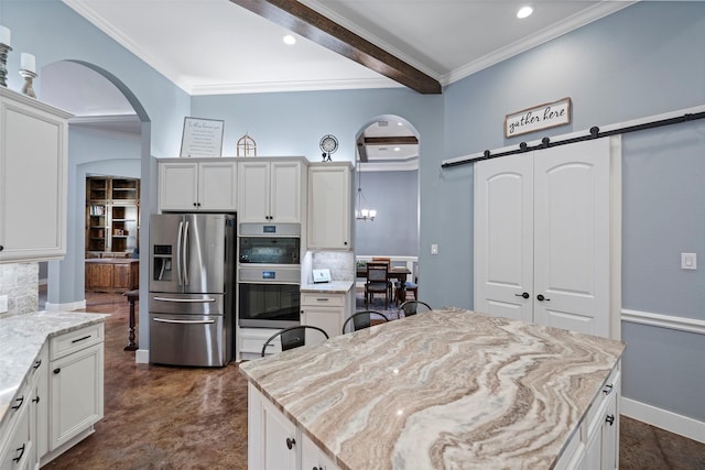 11410 Sunset Ave, Magnolia, TX 77354 - kitchen featuring stainless steel appliances, arched walkways, backsplash, a barn door, and crown molding