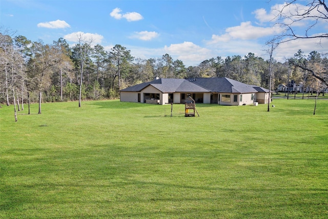11410 Sunset Ave, Magnolia, TX 77354 - view of front of house with a front lawn and view of wooded area