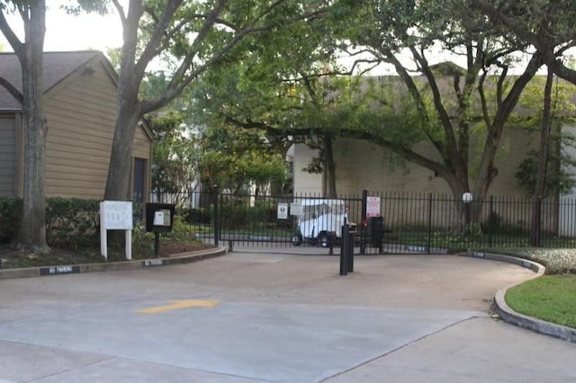 10047 Westpark Dr Unit 46, Houston, TX 77042 - view of road with curbs and a gate