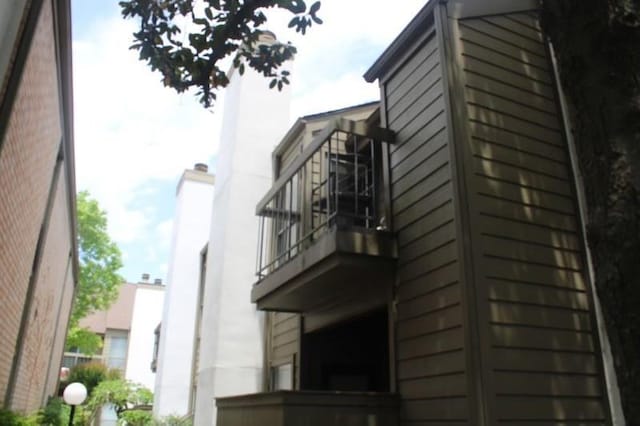 10047 Westpark Dr Unit 46, Houston, TX 77042 - view of property exterior with a balcony