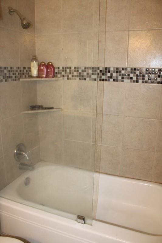 10047 Westpark Dr Unit 46, Houston, TX 77042 - full bathroom with bathing tub / shower combination