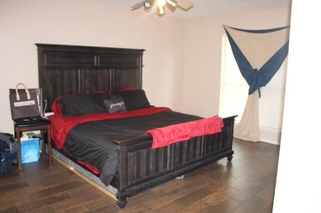 10047 Westpark Dr Unit 46, Houston, TX 77042 - bedroom with wood finished floors and a ceiling fan
