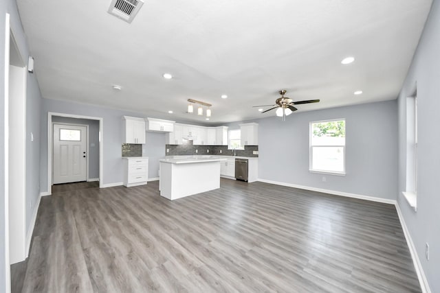 1707 Wilburn, Baytown, TX 77520 - kitchen with open floor plan, a kitchen island, stainless steel dishwasher, ceiling fan, and recessed lighting