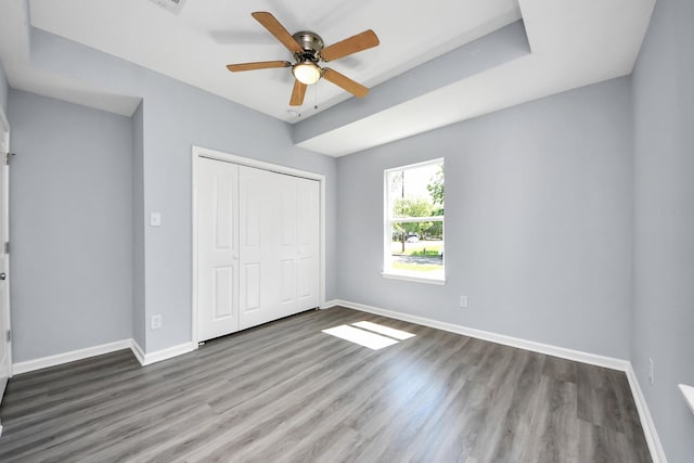 1707 Wilburn, Baytown, TX 77520 - unfurnished bedroom with baseboards, a closet, and wood finished floors