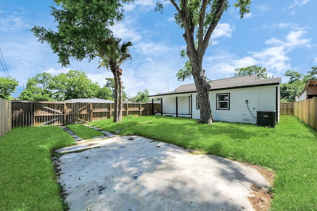 1707 Wilburn, Baytown, TX 77520 - back of house with a patio and central air condition unit
