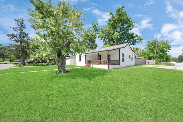 1707 Wilburn, Baytown, TX 77520 - view of front of house with a front yard, driveway, and covered porch