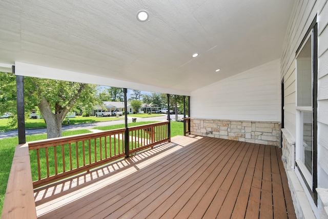 1707 Wilburn, Baytown, TX 77520 - wooden terrace featuring a porch, a yard, and a residential view