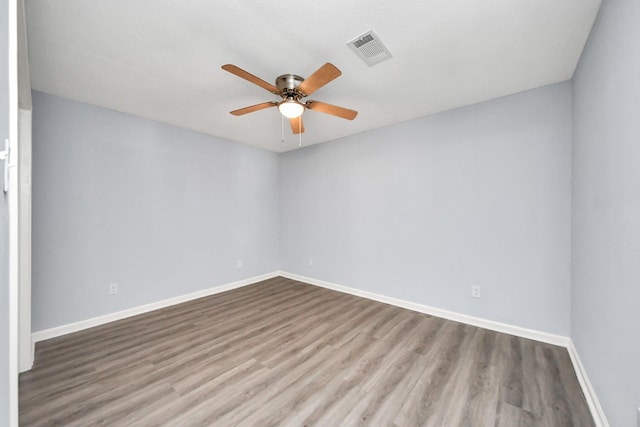 1707 Wilburn, Baytown, TX 77520 - unfurnished room with a ceiling fan, wood finished floors, and baseboards