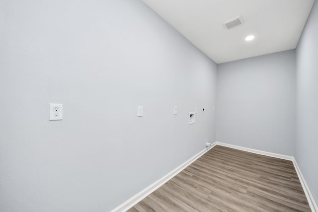 1707 Wilburn, Baytown, TX 77520 - clothes washing area featuring washer hookup, baseboards, wood finished floors, electric dryer hookup, and recessed lighting