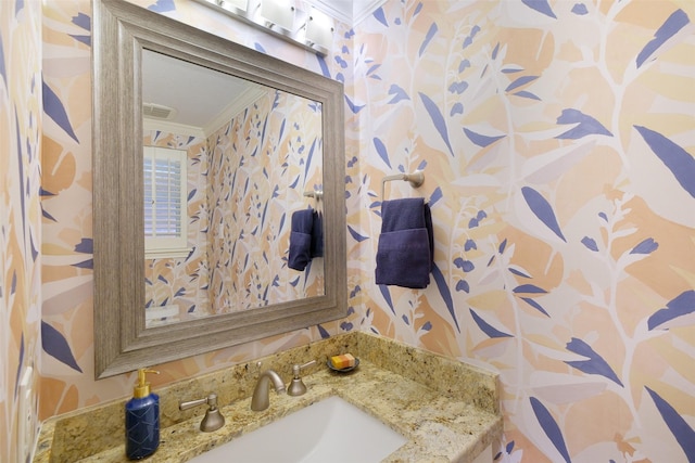 513 Rancho Bauer Dr, Houston, TX 77079 - bathroom featuring wallpapered walls, ornamental molding, and a sink