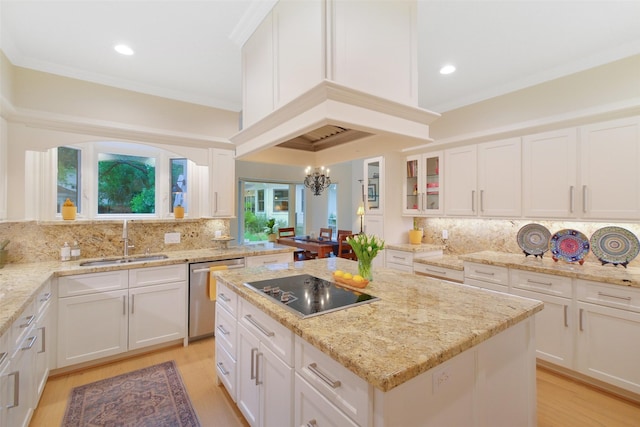 513 Rancho Bauer Dr, Houston, TX 77079 - kitchen with dishwasher, a sink, black electric cooktop, light wood-style flooring, and a chandelier