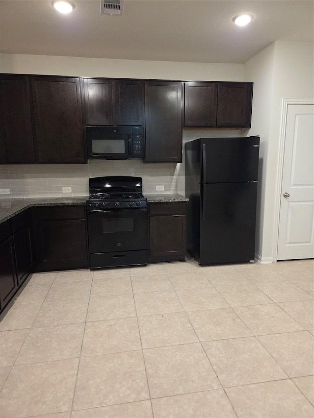 10010 Pine Valley Ct, Baytown, TX 77521 - kitchen with black appliances, dark stone countertops, light tile patterned flooring, backsplash, and recessed lighting
