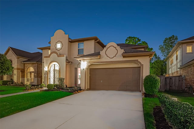 5411 Oban Terrace Ln, Sugar Land, TX 77479 - mediterranean / spanish house with stucco siding, driveway, and a garage