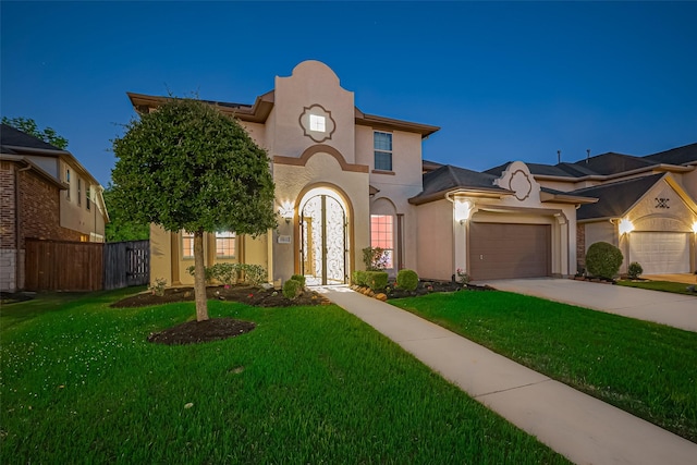 5411 Oban Terrace Ln, Sugar Land, TX 77479 - mediterranean / spanish-style home with stucco siding, an attached garage, and concrete driveway