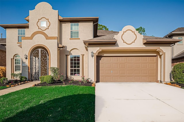 5411 Oban Terrace Ln, Sugar Land, TX 77479 - mediterranean / spanish home featuring driveway, stucco siding, an attached garage, and a front lawn