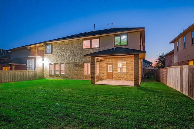 5411 Oban Terrace Ln, Sugar Land, TX 77479 - back of house featuring a patio area, brick siding, and stucco siding