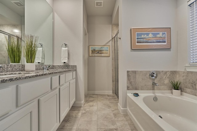 106 Emory Birch Dr, Montgomery, TX 77316 - full bathroom with a stall shower, a bath, double vanity, and baseboards