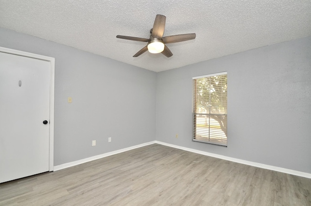 1516 Bay Area Blvd Unit C6, Houston, TX 77058 - spare room with wood finished floors, a ceiling fan, a textured ceiling, and baseboards