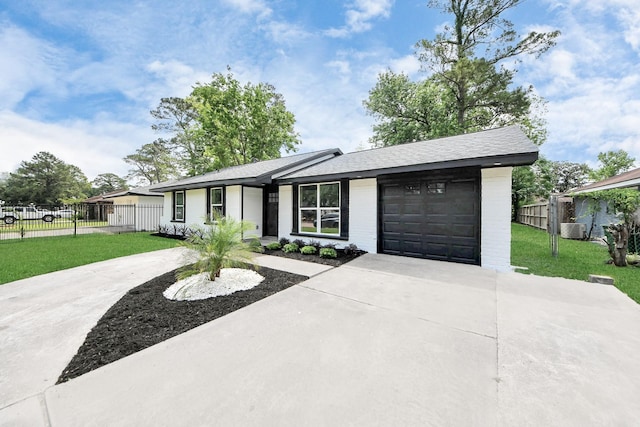 7622 Parker Rd, Houston, TX 77016 - ranch-style house with driveway, an attached garage, central air condition unit, and brick siding