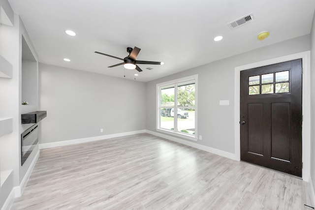 7622 Parker Rd, Houston, TX 77016 - foyer with healthy amount of natural light, ceiling fan, light wood-style flooring, baseboards, and recessed lighting