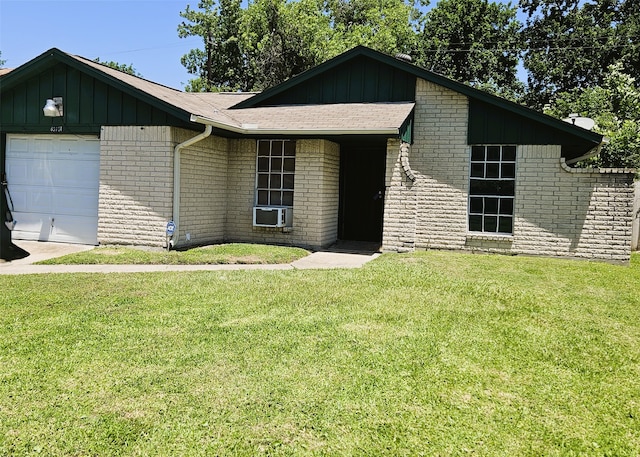 6315 Mardale Dr, Houston, TX 77016 - view of front of property featuring board and batten siding, a front yard, brick siding, and an attached garage