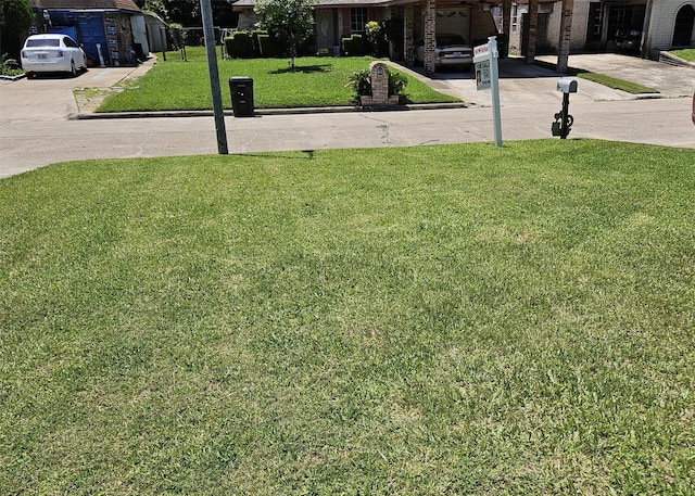 6315 Mardale Dr, Houston, TX 77016 - view of grassy yard with driveway