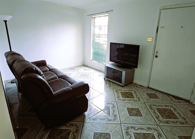 6315 Mardale Dr, Houston, TX 77016 - living room featuring light tile patterned flooring and baseboards